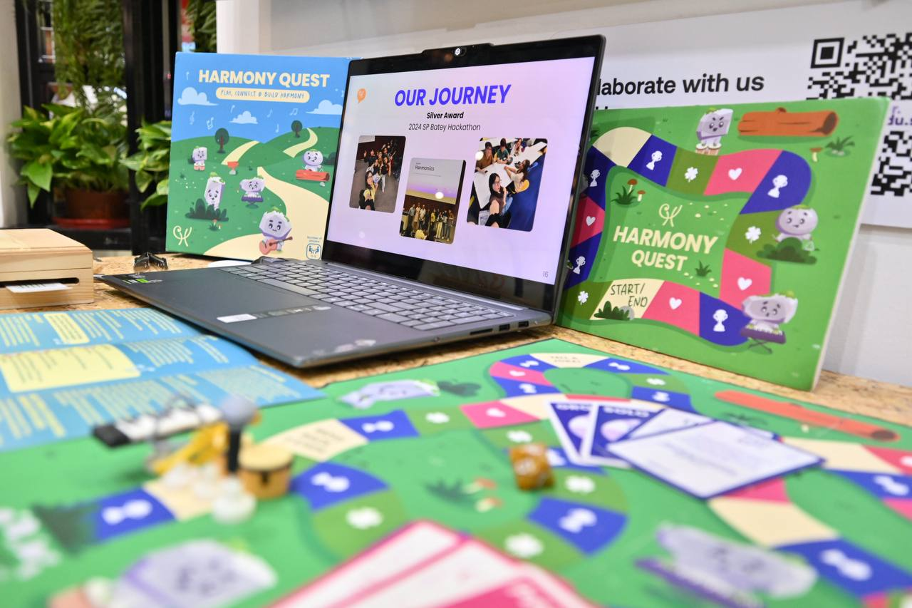 Harmony Quest board, cards, and game components set up on a table