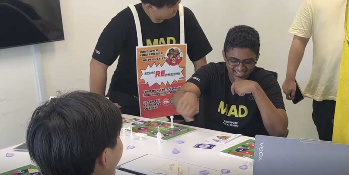 Players smiling and interacting with a live Harmony Quest demo table.